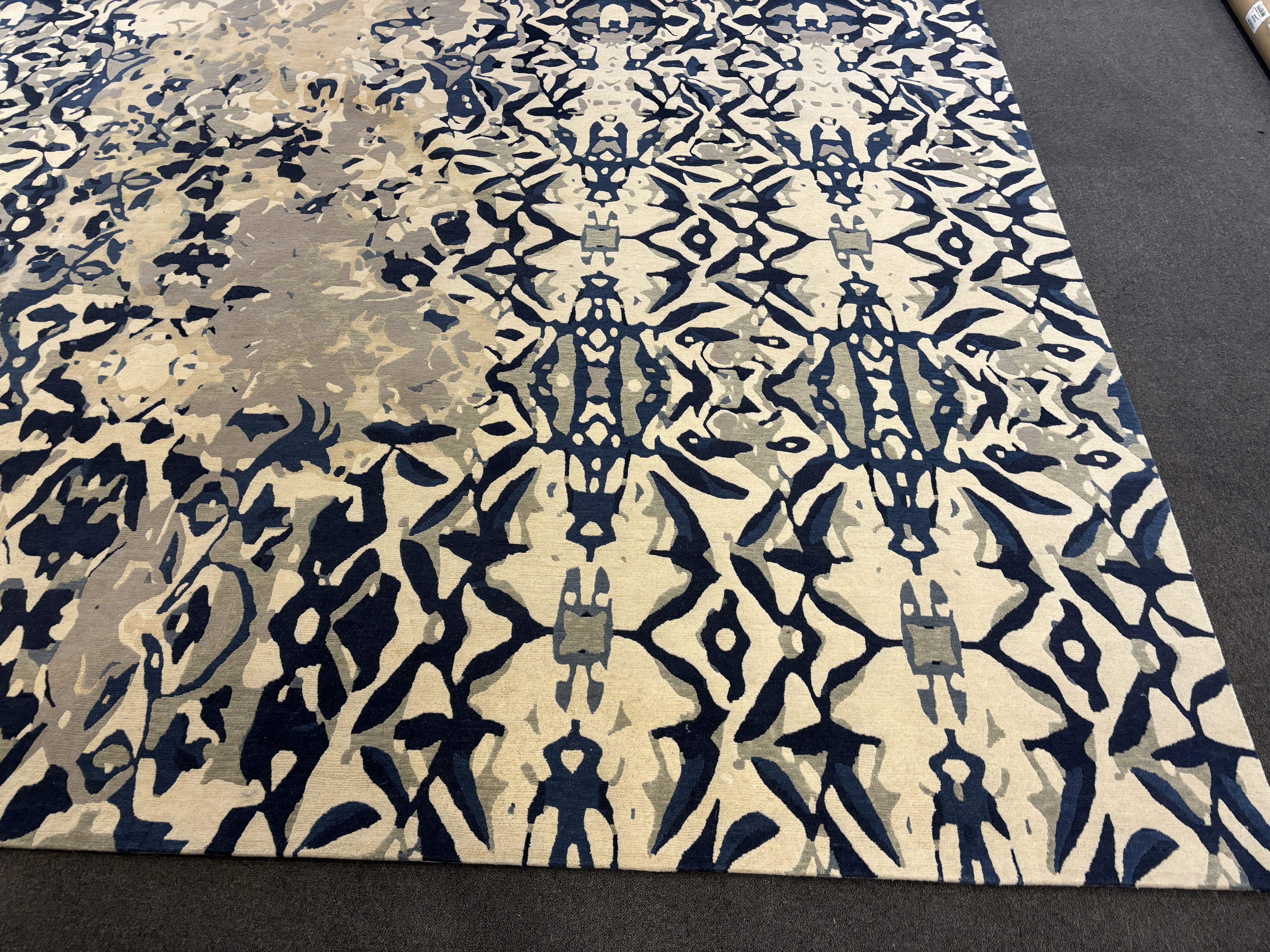 An Elizabeth Ashard 'Moghul', a silk and wool blue tones pattern carpet, 665 x 440cm